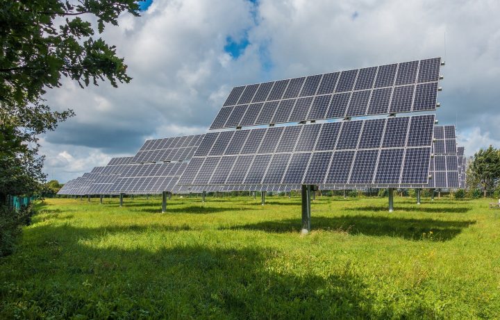 solar PV system with blue sky and meadow
