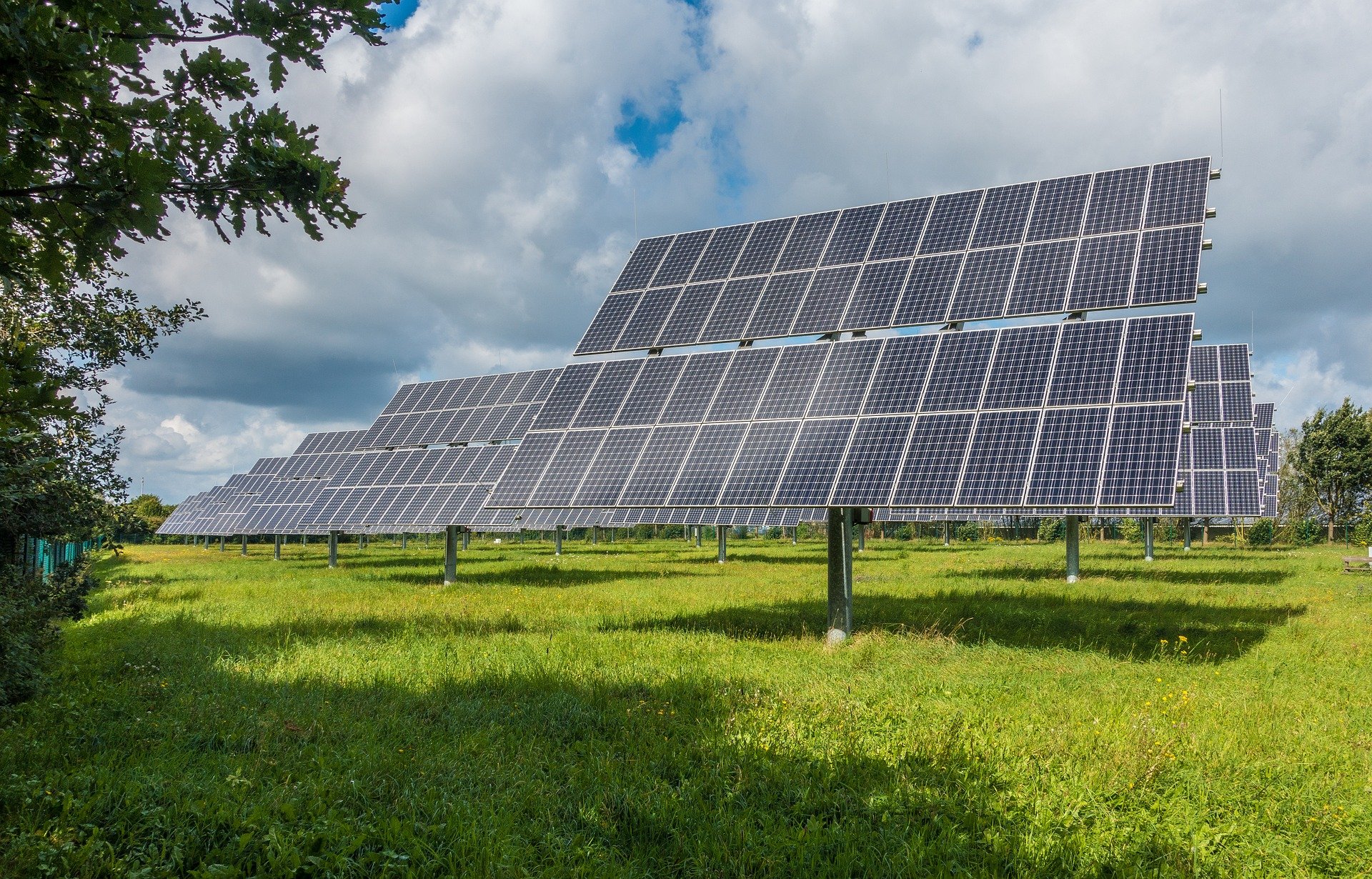 solar PV system with blue sky and meadow