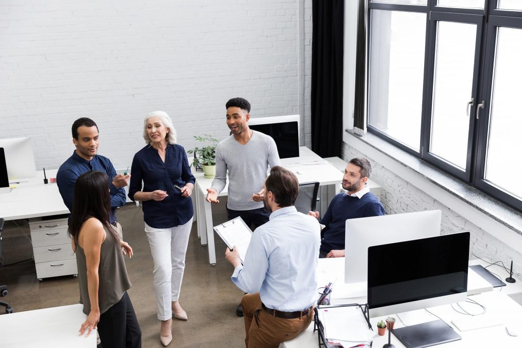 five colleagues in a discussion