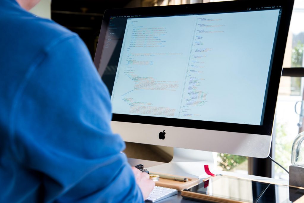 someone staring at his Mac