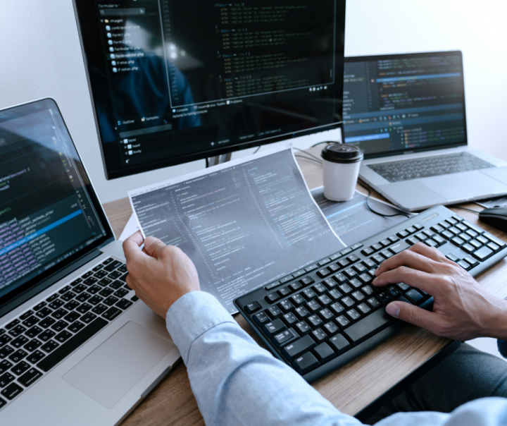 a man facing multiple screens