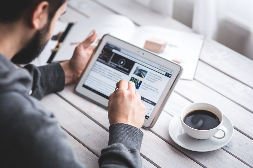a man reading software development trends 2023