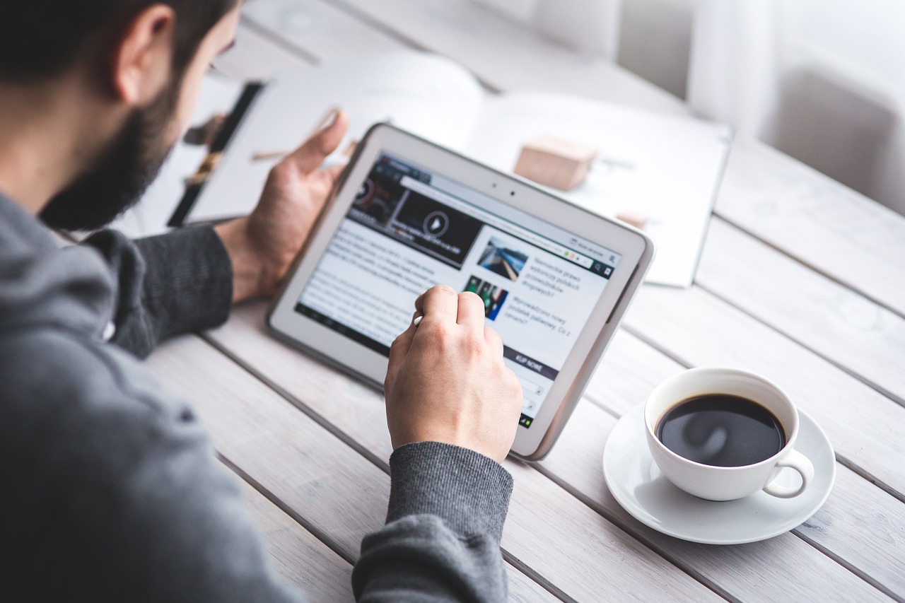 a man reading software development trends 2023