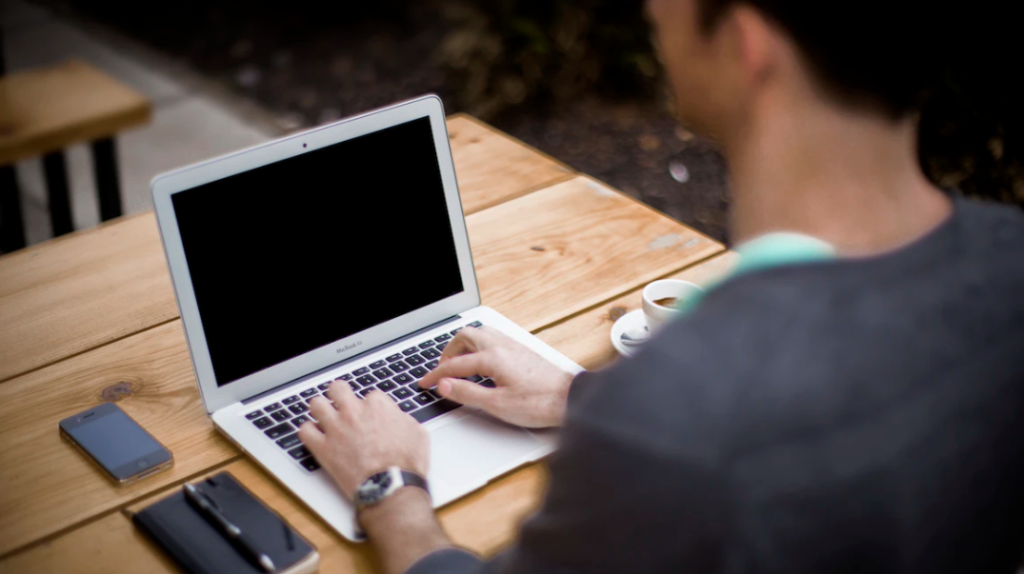 Working on a laptop outdoors